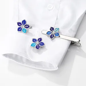 Elegant silver flower cufflinks and tie clip set with blue enamel and crystal inlay