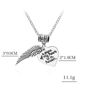Silver heart and feather wing pendant necklace with engraved memorial message for women
