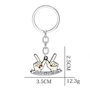 Creative hand gesture keychain featuring Whatever Forever slogan and red nail polish details