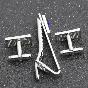 Silver tie clip and cufflinks set with square blue gem and detailed textured finish