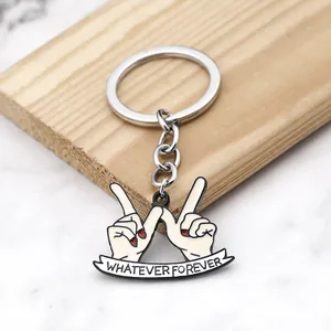 Creative hand gesture keychain with Whatever Forever banner and red enamel finger details