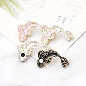 Cute koi fish enamel pins set in pink and white on a marble background display