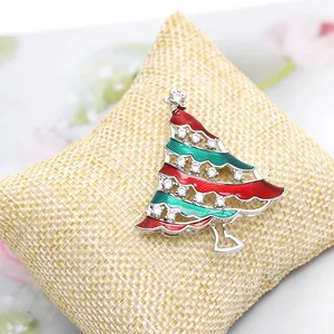 Elegant Christmas tree brooch with red and green enamel and sparkling zircon accents