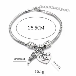 Silver bead snake chain bracelet with heart and wing charms featuring LOVE engraving