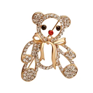 Goldene Teddybär-Brosche mit funkelnden Strasssteinen und roter Edelsteinnase