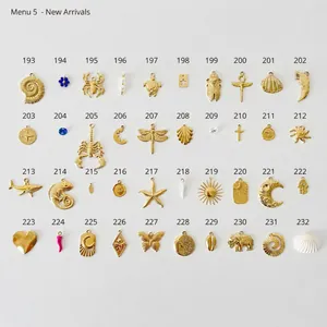 Detailed grid of diverse gold-plated charms including lotus, feathers, and nature symbols