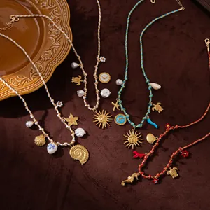 Detail of four colorful woven cord necklaces with lotus and sea-themed gold pendants