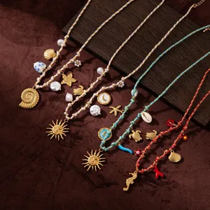 Detailed shot of Bohemian woven necklaces with sea turtle, starfish and sun pendants