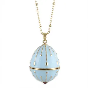 Detailed view of a light blue enamel egg pendant necklace with gold accents.