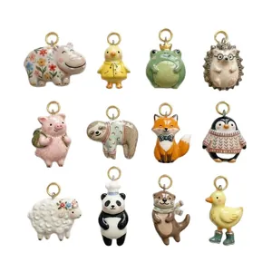 Set of 12 colorful ceramic animal charms featuring hippo frog and pig with gold rings