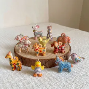 Hand-painted ceramic animal charms including deer and rabbits for DIY jewelry making
