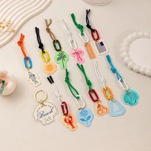 Colorful summer beach theme keychain charms with shell, palm tree, and cherry pendants
