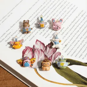 Set of 8 colorful mini animal charms including rabbits and frogs for jewelry making