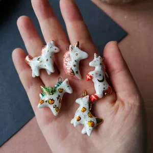 Handcrafted unicorn ceramic pendants with 14K gold details for DIY jewelry making