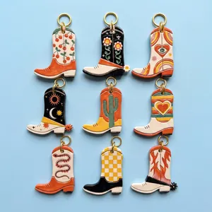 Retro cowboy boot pendants set with colorful vintage patterns and gold metal rings