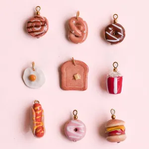 9-piece collection of 18k gold plated food pendants featuring donuts and burgers