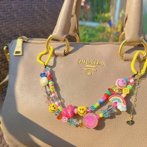 Colorful beaded keychain with smiley face and heart charms for bags and phones