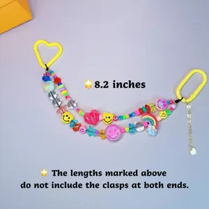 Detail of colorful Y2K beaded chain with acrylic smiley faces and hearts for DIY bags
