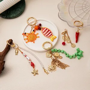 Vintage chili and starfish bag charms set with colorful beads and gold tassels