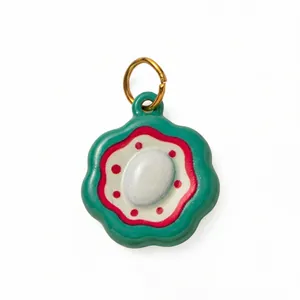 18K gold plated stainless steel green flower pendant with red enamel details and a loop