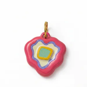 Colorful mushroom shaped pendant with 18K gold plated ring on a white background