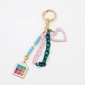 Porte-clés tendance avec chaînes colorées et pendentif cœur pour sacs à main femmes