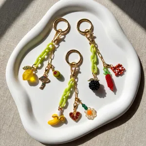 Dreiteiliges Gold-Seestern- und Frucht-Schlüsselanhänger-Set mit grüner Kette