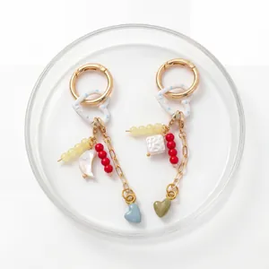 Detail of 18K gold-plated DIY keychain with colorful heart charms and beads