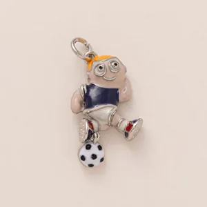 Detail of cartoon soccer player charm with enamel finish and metal ring for DIY jewelry
