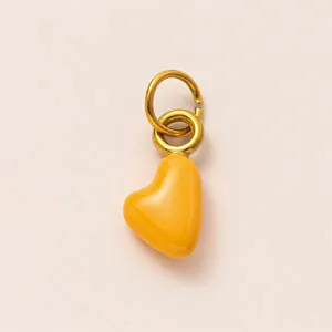 Close-up of yellow heart-shaped pendant with polished 18K gold-plated double rings