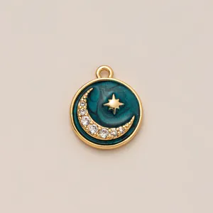 Detail of round gold pendant with blue enamel, sparkling crescent moon and star charm