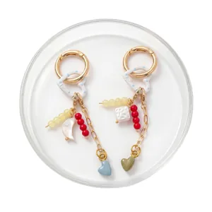 18K gold-plated keychain set with heart pendants and colorful beads on white background