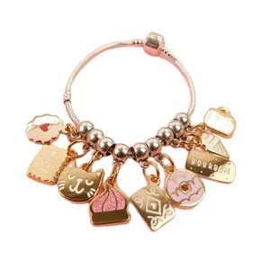 Rose gold charm bracelet featuring enamel cat, biscuit, and sweet dessert pendants