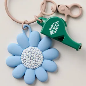 Cute daisy flower bag charm with dark green whistle and pink metal lobster clasp