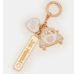Detail of Just Married 2026 wedding keychain with enamel heart and vintage car charms