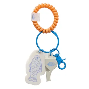 Cute fish and flower whistle bag charm with orange telephone wire wristband and blue lobster clip
