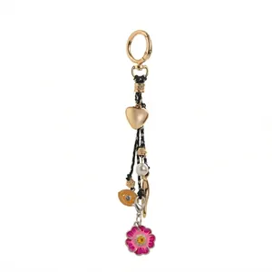 Handmade woven bag charm with heart, pearl, evil eye, and pink flower pendant charms