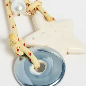 Retro star and heart ceramic beaded bag charm with colorful woven cord and pearl detail