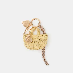 Mini straw bag keychain with golden shell pendant and brown white stripe rope knot