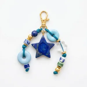 Vintage star and heart ceramic bead bag charm with gold metal clasp and blue stones