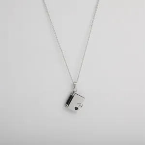 Silver book-shaped locket necklace in stainless steel with hollow heart pendant