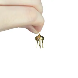Gold jellyfish pendant with crystals and baroque natural pearl on a delicate beach necklace