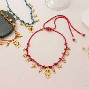 Detailed view of adjustable marine necklaces with golden sea life charms and colorful cords