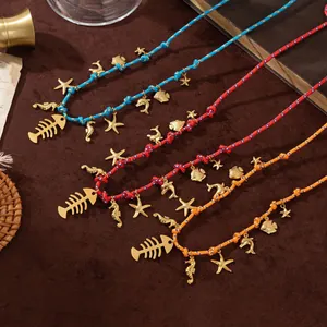 Detailed close-up of woven rope necklaces with 18K gold plated sea life charms