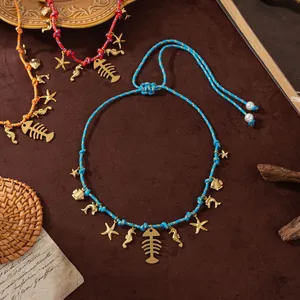 Detailed shot of ocean-themed braided ropes with golden starfish and seahorse charms
