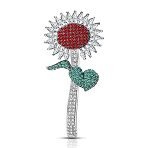 Elegant sunflower brooch with red centers, marquise zircon petals, and green leaf accents
