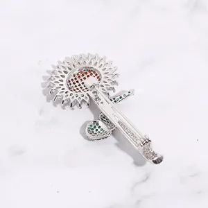Detail of sunflower brooch back showing silver metal clasp and precision casting