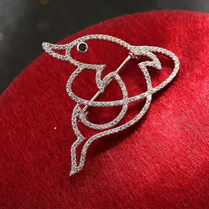 Exquisite hollow dolphin brooch in silver finish with pavé cubic zirconia and black eye