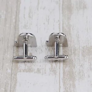 Formal heart-shaped silver metal cufflinks for men featuring classic bullet back closure