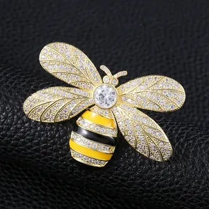 Exquisite gold bee brooch featuring sparkling zircons and yellow-black enamel detail